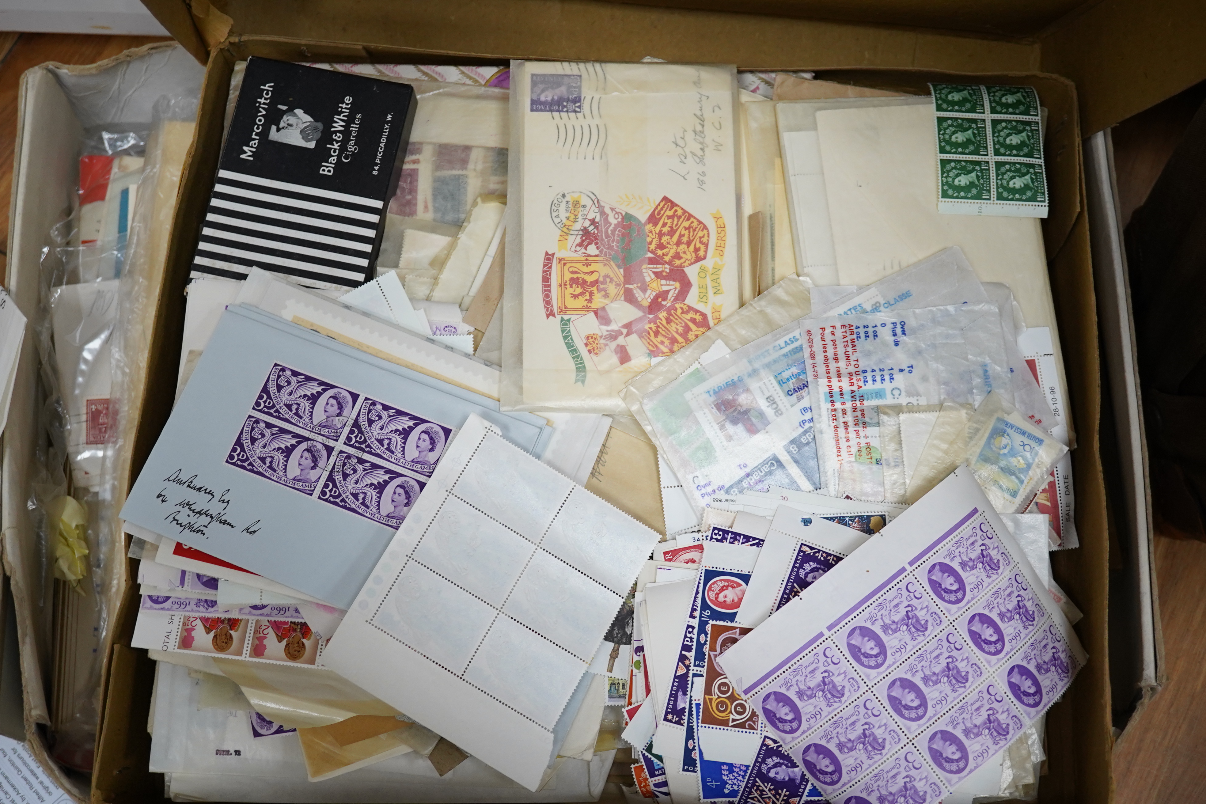A large quantity of mint stamps, booklets, autograph albums, a sketch book, photos, etc. (2 boxes). Condition - mixed, poor to good